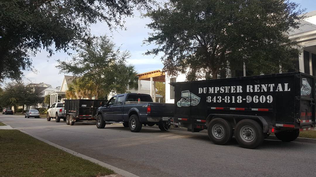 two trucks hauling trailers Rent Dump Trailers